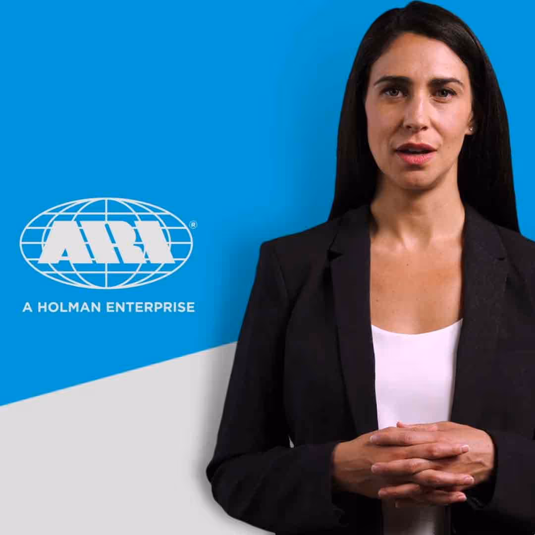 Woman with long dark hair wearing a black blazer and white top, standing against a blue and gray background with ARI logo and text 'A Holman Enterprise'.